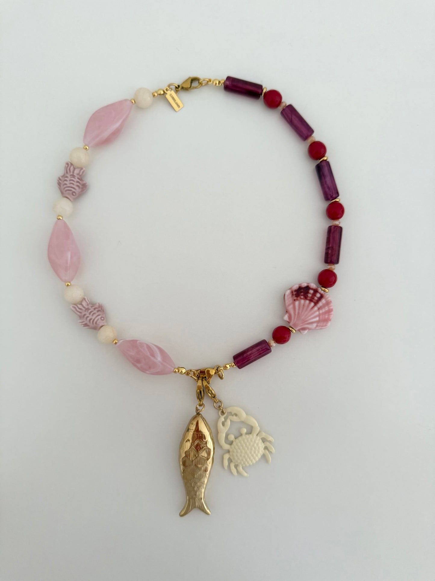 Charm pez dorado