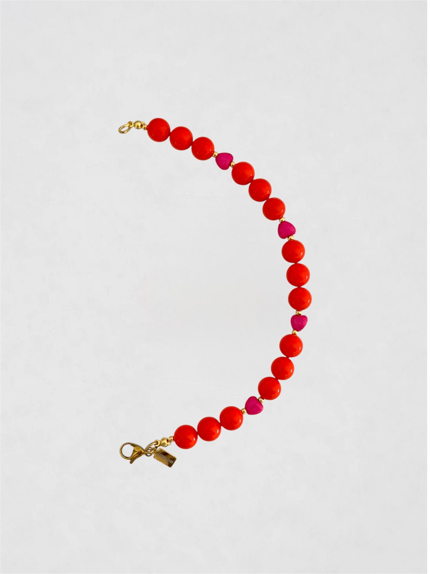 Mitad Collar Naranja y corazoncitos rosas